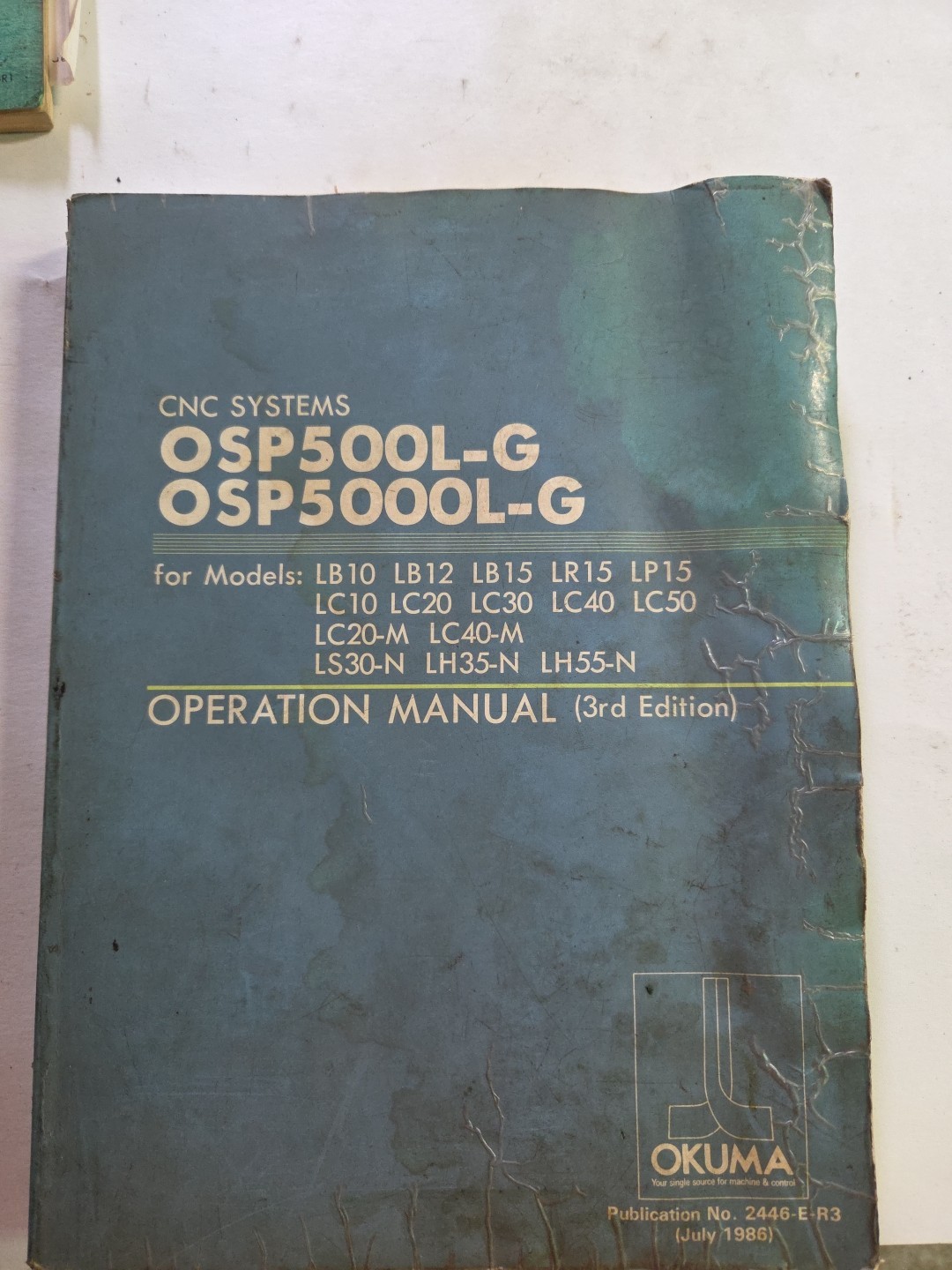 Okuma 2446-E-R3 Operation Manual OSP 500L-G / 5000L-G July 1986 3rd Edition