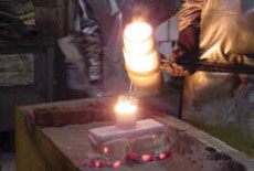 Pouring of a steel casting in a ceramic mold